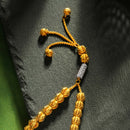 A gold tasbeeh by HANIF