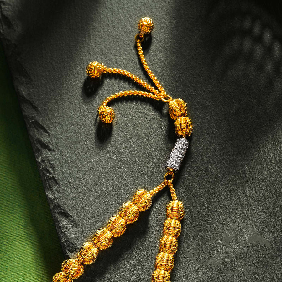 A gold tasbeeh by HANIF